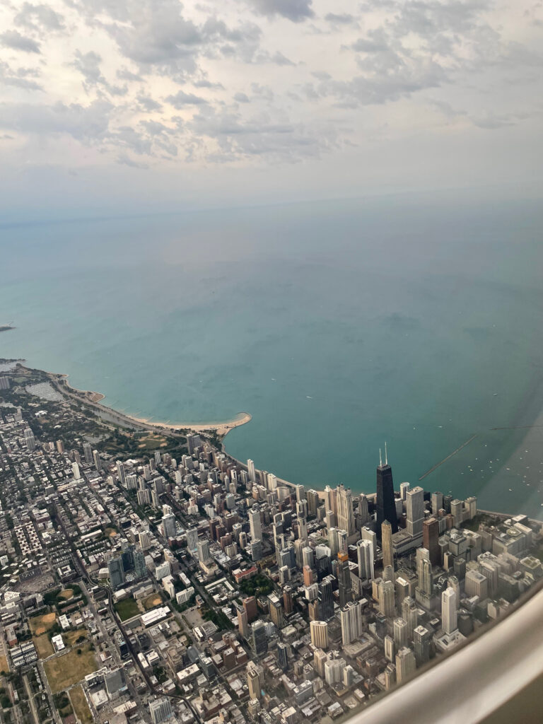 Flying over the city of Chicago showing the shore of Lake Michigan