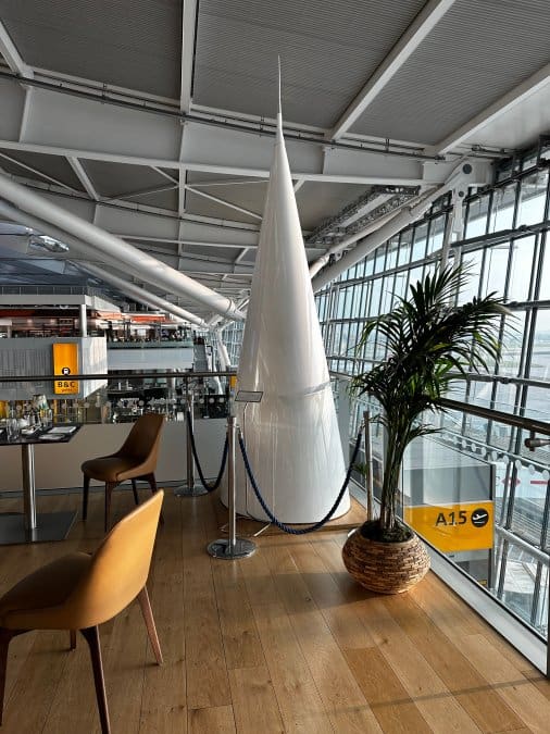 LHR has the cone from the famed Concorde on display in the first class area.