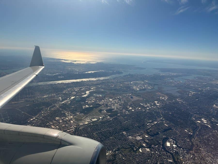 Descending toward New York with Manhattan off the wing. This is when your ear routine should already be running.