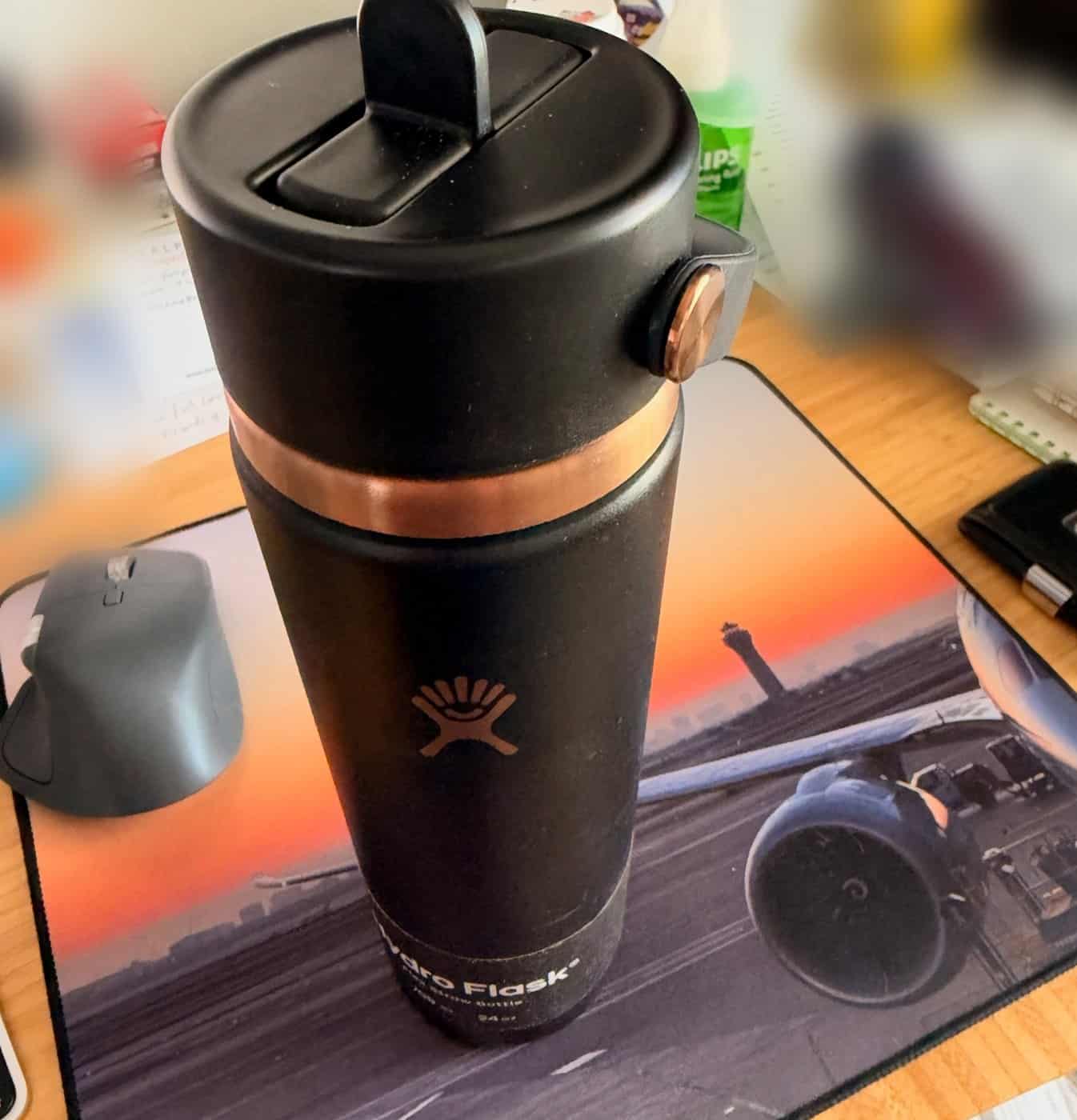 How to Stay Hydrated on Long Haul Flights 2026 Hydro Flask 24 oz Flex Straw bottle for long haul flights on an airplane mousepad