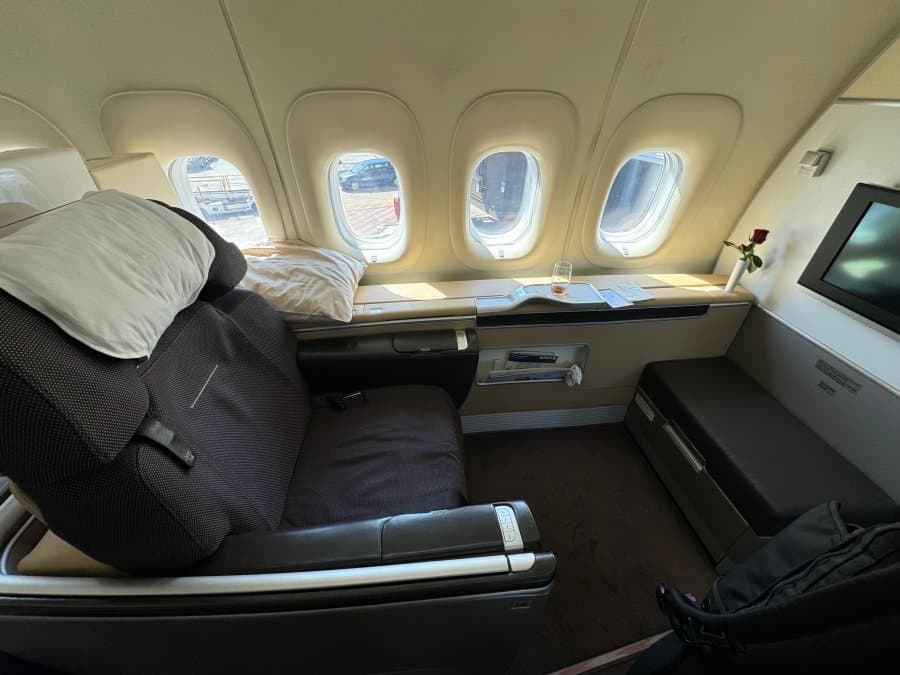 Is Extra Legroom Worth It? A Traveler's Honest Review First class suite with a row of windows, the most legroom money can buy